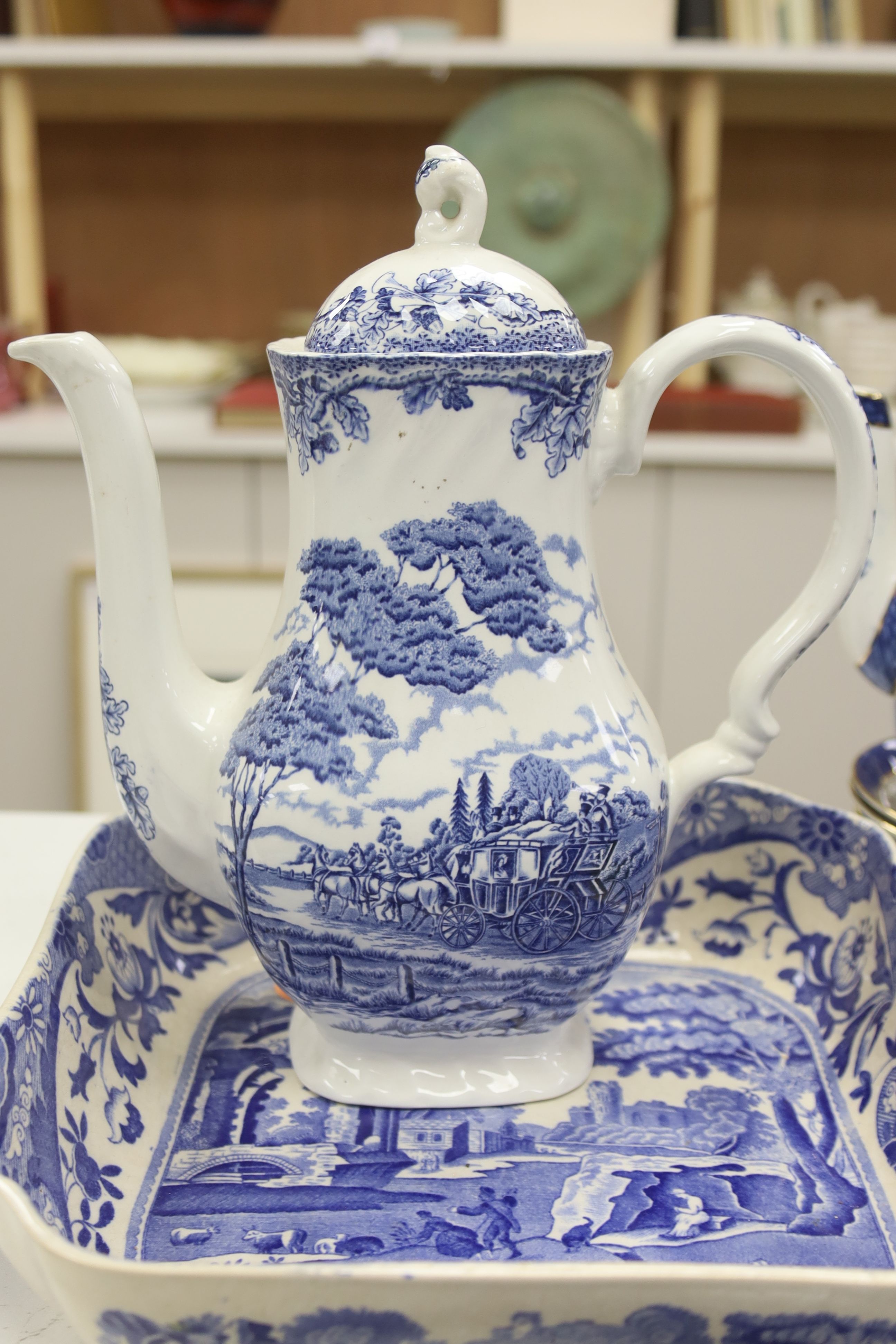 A Wedgwood blue and white willow pattern meat dish, a Copeland Spode Tower pattern square shaped bowl & a blue and white coffee pot (3)